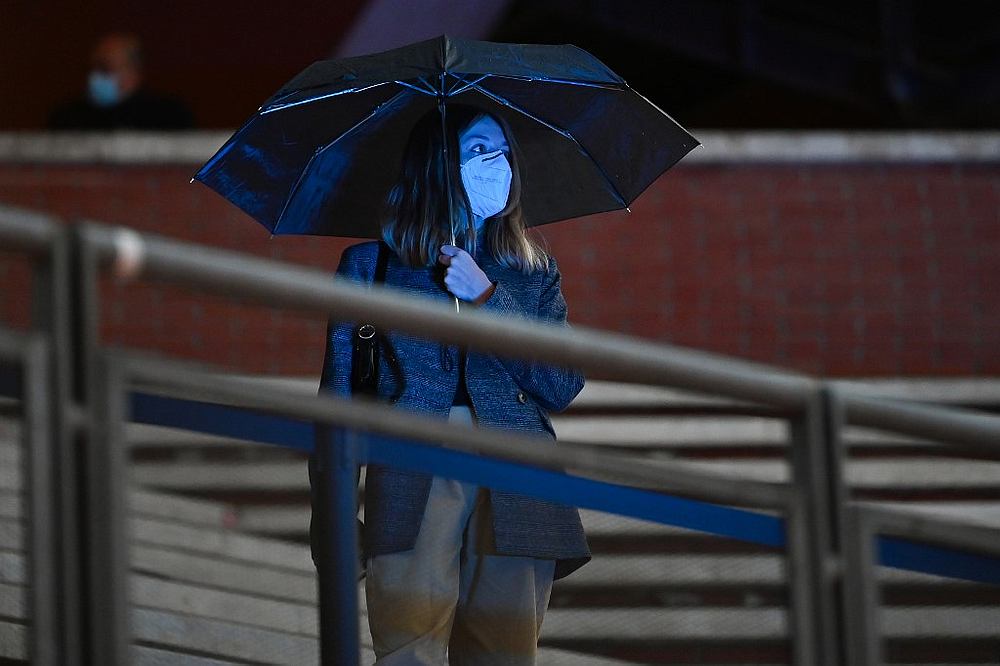 A spectator holds an umbrella as she attends the screening of the film 'Soul' during the 15th Rome Film Festival at the Auditorium Parco della Musica in Rome October 15, 2020. u00e2u20acu201d AFP pic