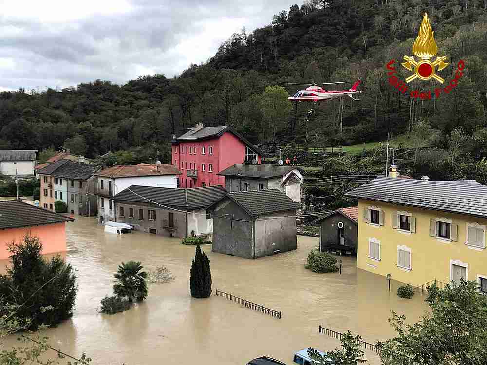 A fire brigade helicopter carries out rescue operation in flooded area in Ornavasso, Italy, October 4, 2020. u00e2u20acu201d Vigili del Fuoco handout via Reuters