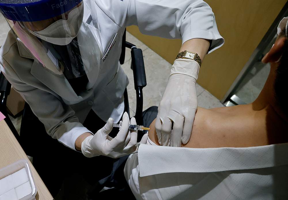 A man gets an influenza vaccine at a branch of the Korea Association of Health Promotion in Seoul, South Korea October 23, 2020. u00e2u20acu201d Reuters pic