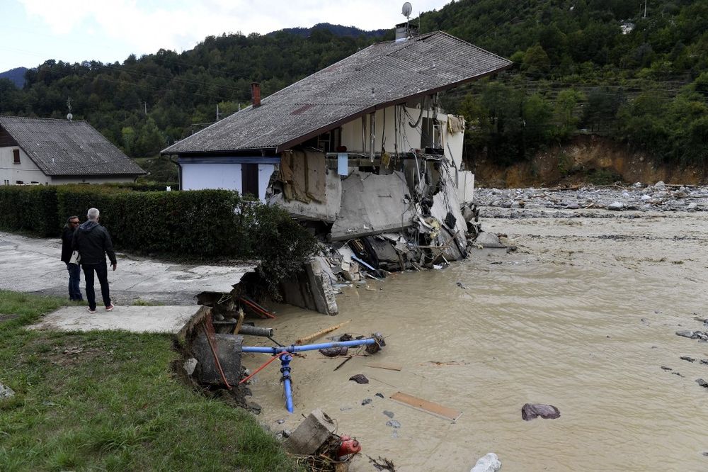 People stand near a house destroyed by the floods of the Vesubie river in Roquebilliere, south-eastern France, on October 3, 2020 after heavy rains and floodings hit the Alpes-Maritimes department. u00e2u20acu201d AFP pic