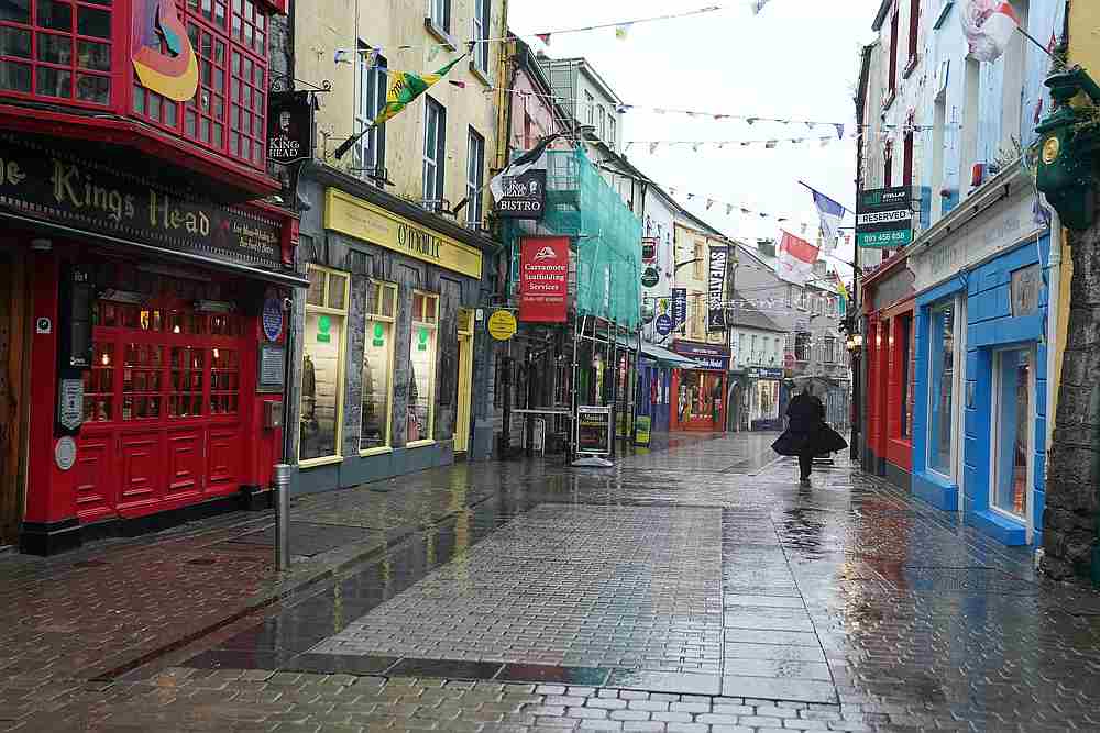 A woman walks through an empty city centre shopping street as the Covid-19 outbreak continues, in Galway, Ireland October 19, 2020. u00e2u20acu201d Reuters pic