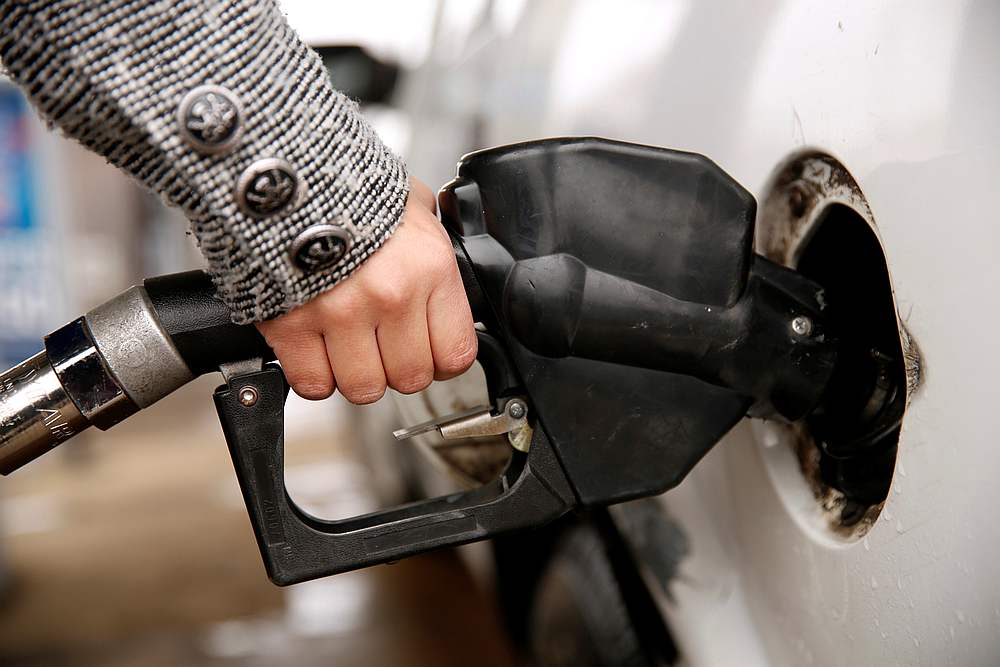 A woman pumps gas at a station in Falls Church, Virginia, December 16, 2014. u00e2u20acu201d Reuters pic