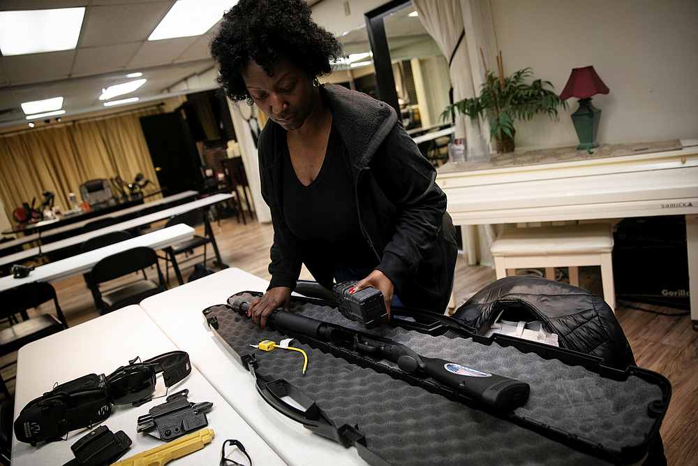 Andreyah Garland, a 44-year-old single mother of three daughters and member of the Hudson Valley Nubian Gun Club, opens a case with her Mossberg 590M 12 gauge shotgun in Newburgh, New York October 13, 2020. u00e2u20acu201d Reuters pic