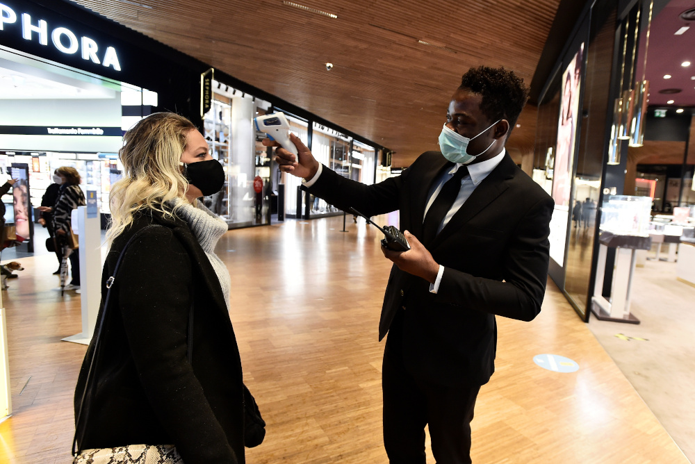 A customer has her temperature checked at a shopping mall ahead of weekend closure of shopping centres, a measure imposed by the Lombardy region to curb the coronavirus disease infections, in Milan, Italy, October 23, 2020. u00e2u20acu201d Reuters pic 