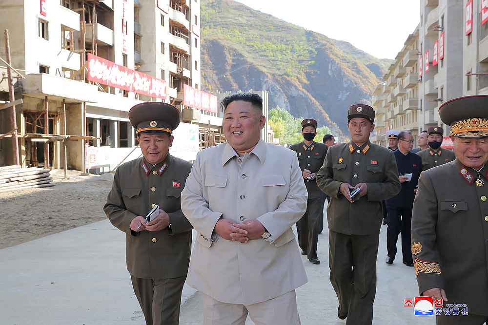 North Korean leader Kim Jong-un inspects a damage recovery site affected by heavy rains and winds in Geomdeok district, South Hamgyong province, North Korea, in this photo released October 13, 2020. u00e2u20acu201d KCNA pic via Reuters 