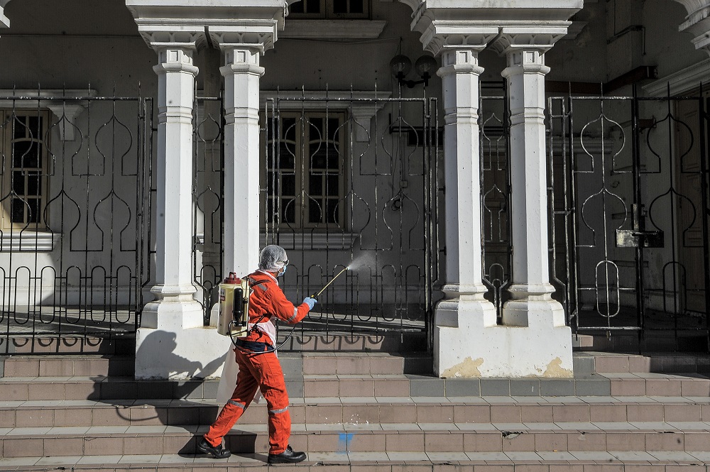 A worker sprays disinfectant at public areas to curb the spread of Covid-19 in Kuala Lumpur October 16, 2020. ― Picture by Shafwan Zaidon
