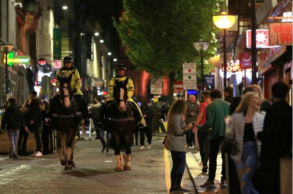 Police patrolled on horseback in Liverpool Saturday as people stayed out late partying. u00e2u20acu201d AFP pic