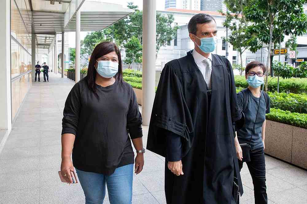 Parti Liyani (left) and her lawyer Anil Balchandani (centre) outside the Singapore High Court October 27, 2020. u00e2u20acu201d TODAY pic