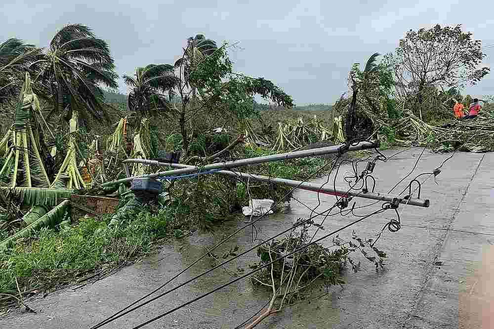 A fallen electric post blocks a road after tropical storm Molave hit the town of Pola, Oriental Mindoro province, Philippines October 26, 2020. u00e2u20acu201d AFP pic