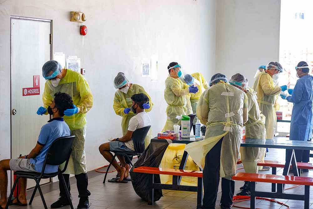 Foreign workers undergoing the antigen rapid test. u00e2u20acu201d Singapore Ministry of Manpower pic via TODAY