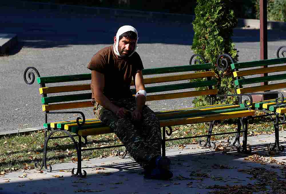An injured man sits on a bench near a hospital in Stepanakert in the course of a military conflict over the breakaway region of Nagorno-Karabakh, October 17, 2020. u00e2u20acu201d Reuters pic