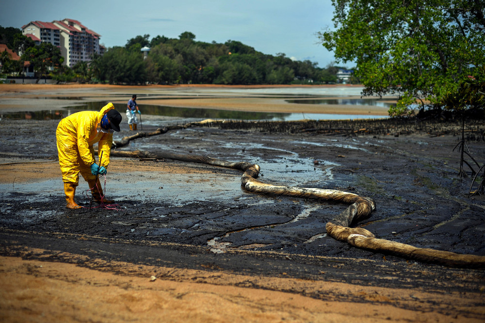Work to clean up the oil spill being carried out in the mangrove area in Tanjung Tuan, October 18, 2020. u00e2u20acu201d Bernama pic 