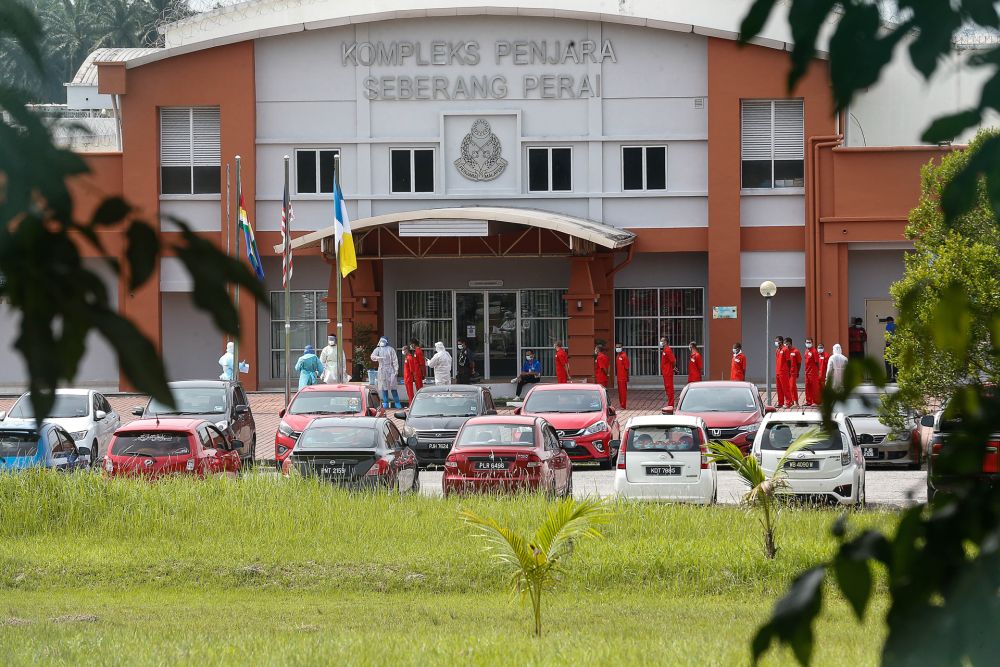 Inmates queue up to be tested for Covid-19 at the Seberang Perai Prison in Nibong Tebal on October 15, 2020. u00e2u20acu201d Picture by Sayuti Zainudin