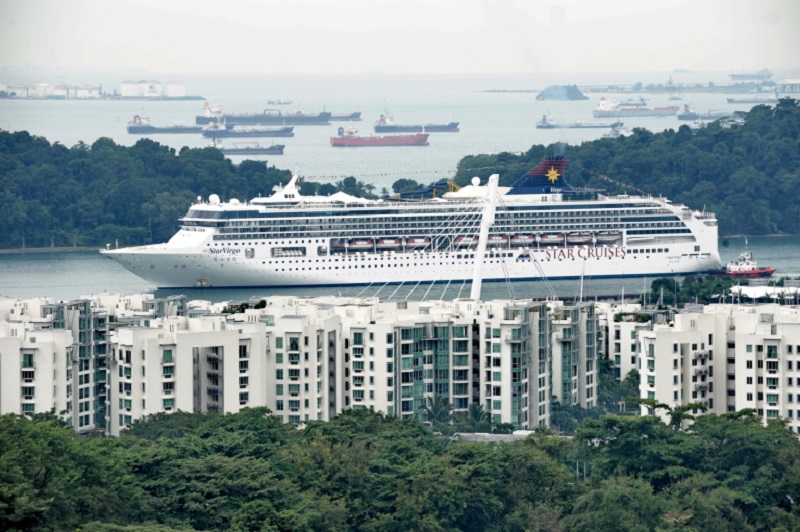 A Star Cruise passengers vessel passing through a narrow channel heading towards the harbour front in Singapore in 2011. u00e2u20acu2022 AFP pic 