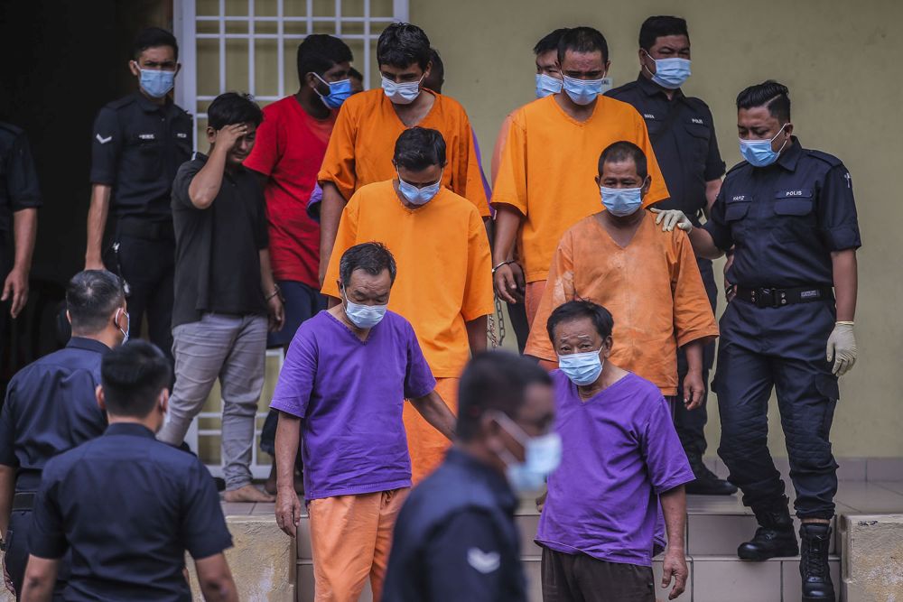 The suspects from a company allegedly responsible for Sungai Selangoru00e2u20acu2122s odour pollution are pictured at the Selayang Magistrateu00e2u20acu2122s Court October 21, 2020. u00e2u20acu201d Picture by Hari Anggara