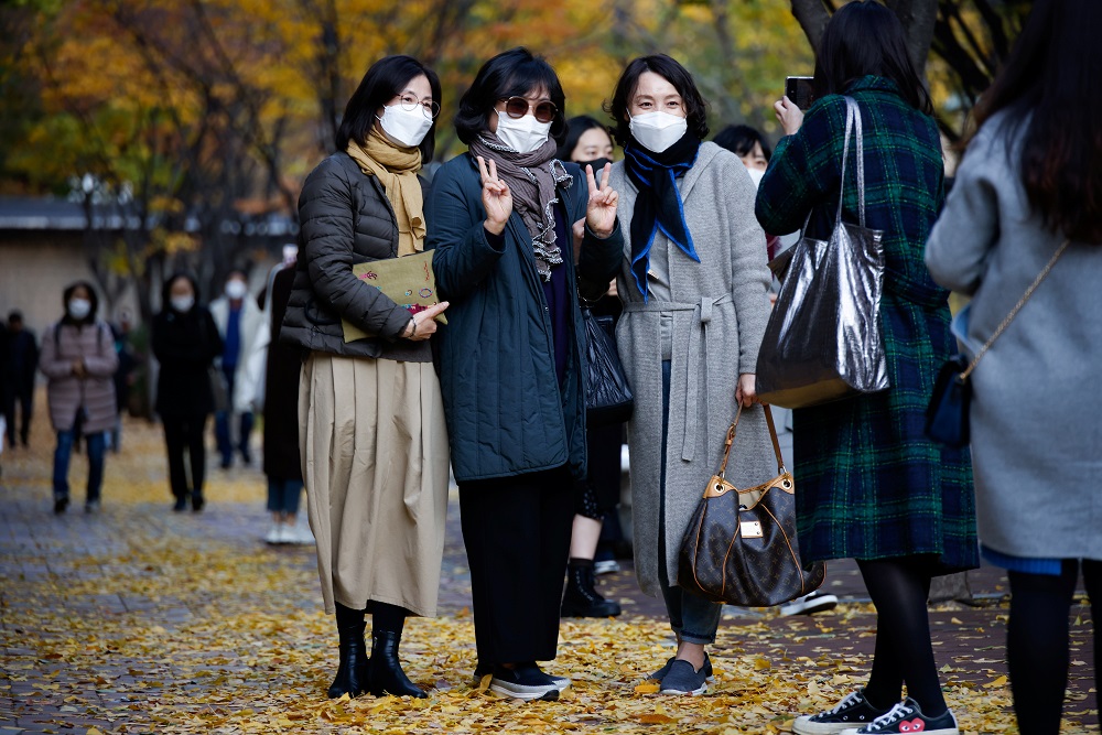 Women pose for photographs as they enjoy an autumn day amid the coronavirus disease pandemic in Seoul November 3, 2020. u00e2u20acu201d Reuters pic