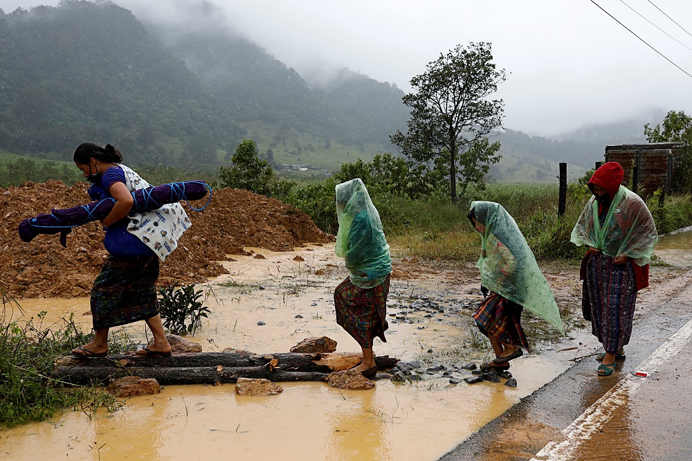 Women walk at an area affected by a mudslide after the passage of Storm Eta, in Purulha, Baja Verapaz, Guatemala November 6, 2020. u00e2u20acu201d Reuters pic