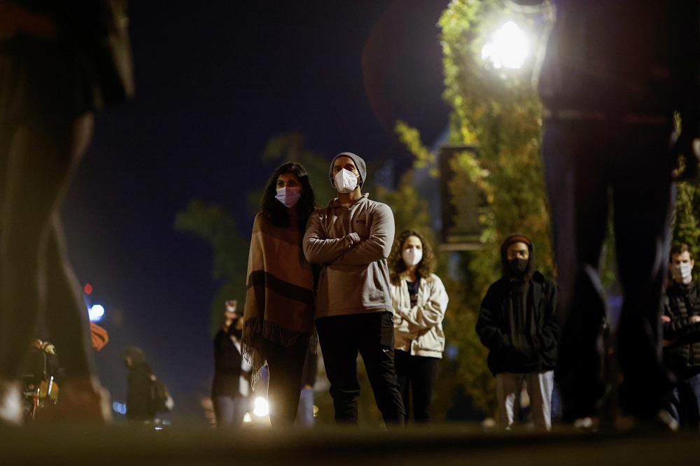 People listen to a speech of US Democratic presidential nominee Joe Biden from Delaware through speakers outside the White House in Washington November 6, 2020. u00e2u20acu201d Reuters pic