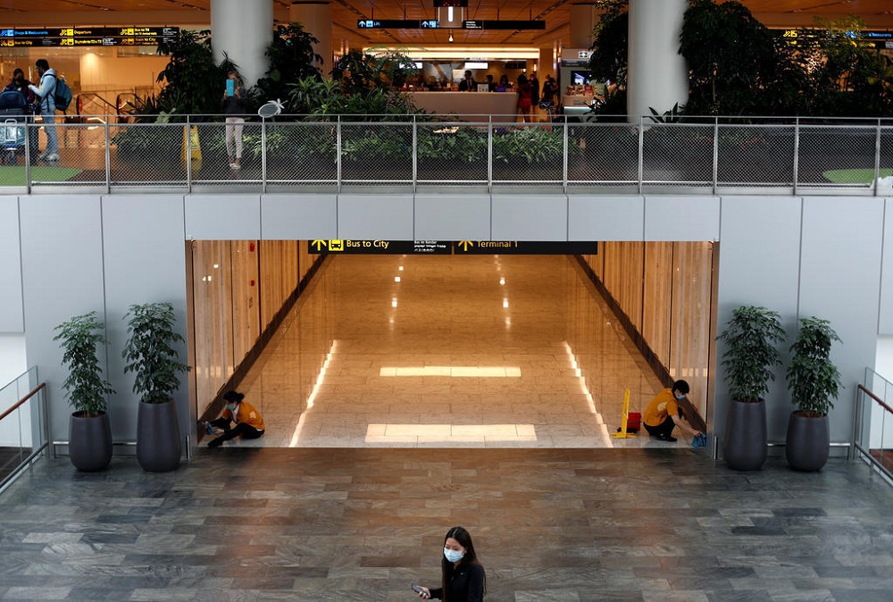Cleaners wearing masks in precaution of the coronavirus outbreak clean a corridor at Changi Airport in Singapore earlier in February. u00e2u20acu201d Reuters pic