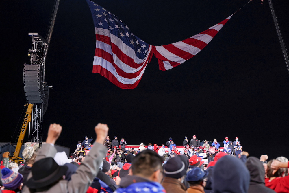 The wind spins a large US flag into two halves as US President Donald Trump rallies with supporters at a campaign event in Montoursville, Pennsylvania October 31, 2020. u00e2u20acu201d Reuters pic