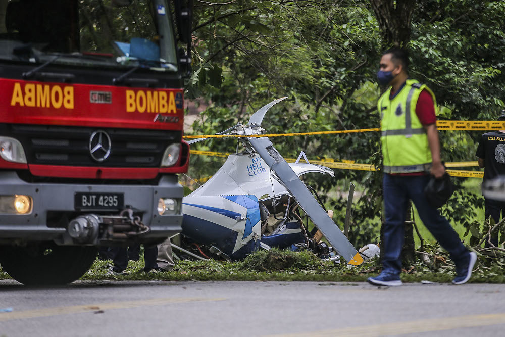 A member of the Fire and Rescue Department is seen during the helicopter crash in Melawati on November 8, 2020. — Picture by Hari Anggara