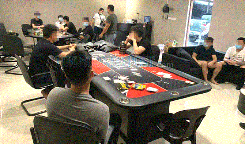 A police handout photo shows the suspects inside the mini casino during the bust.  u00e2u20acu201d  Borneo Post Online pic