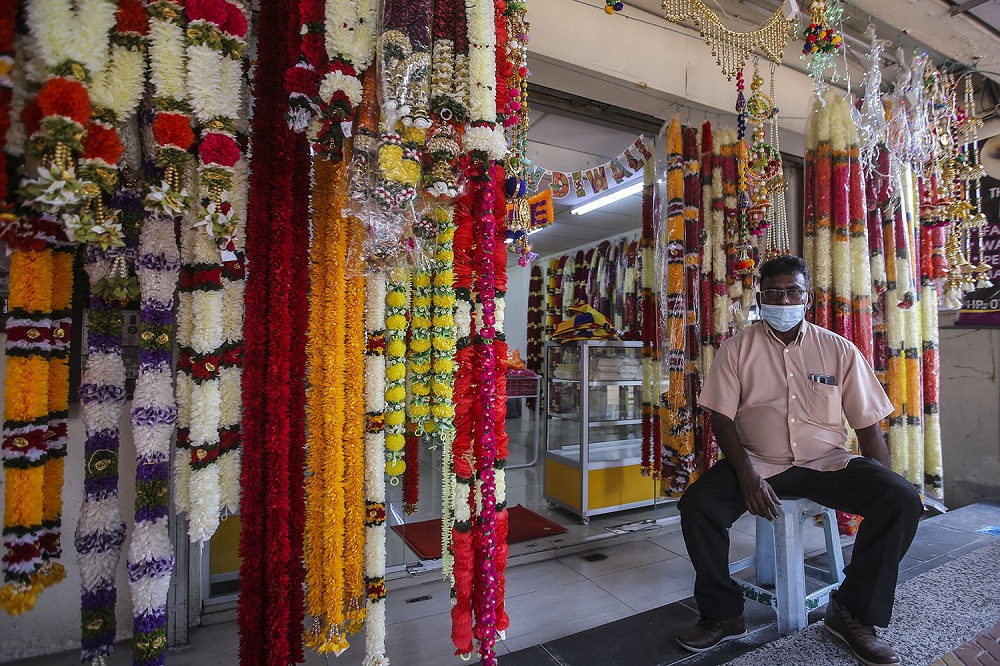 Vijayan Somasundram waits for customers outside his shop in Brickfields ahead of the Deepavali celebrations in Kuala Lumpur November 12, 2020.