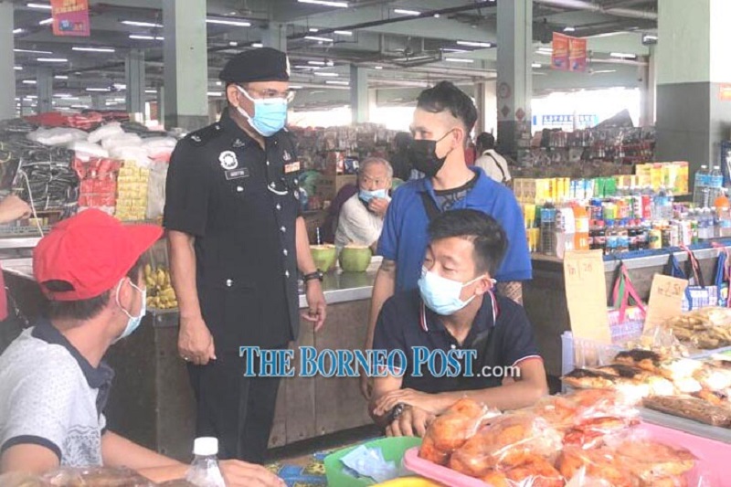 Sibu Crime Prevention and Community Safety Division head DSP Ariffin Bahar (left) inspects one of the stalls at Sibu Central Market. u00e2u20acu201d Borneo Post Online pic