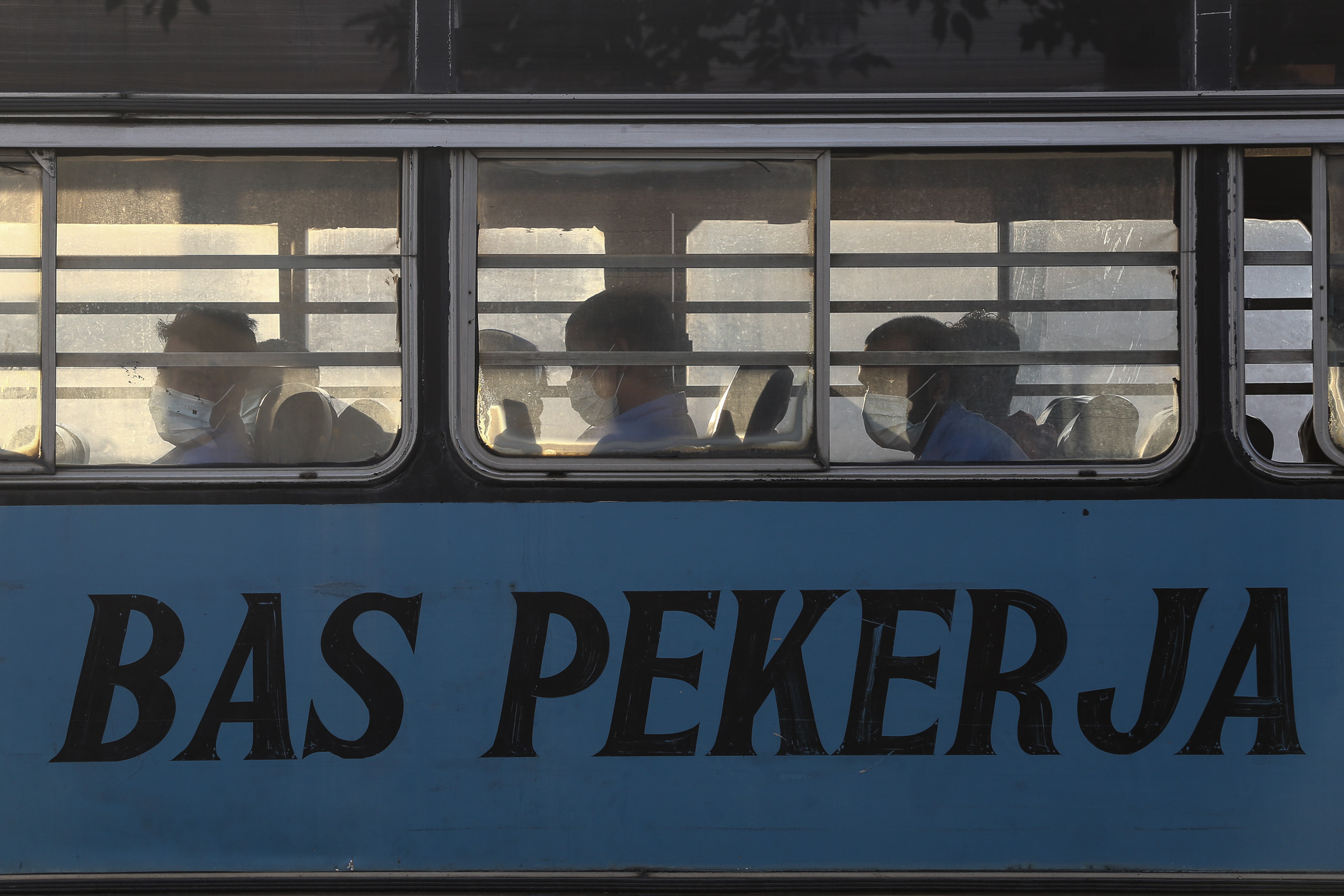 Top Glove Corporation Berhadu00e2u20acu2122s workers are seen in a bus in Klang November 16, 2020. u00e2u20acu201d Picture by Yusof Mat Isa  
