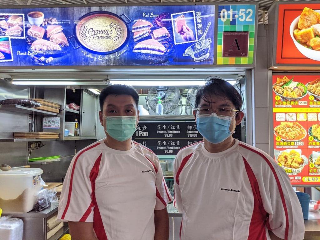 Ken Chew (left) and Steven Goh (right) in front of Grannyu00e2u20acu2122s Pancake hawker stall, where they did their apprenticeship under the Hawkersu00e2u20acu2122 Development Programme. u00e2u20acu201d TODAY pic