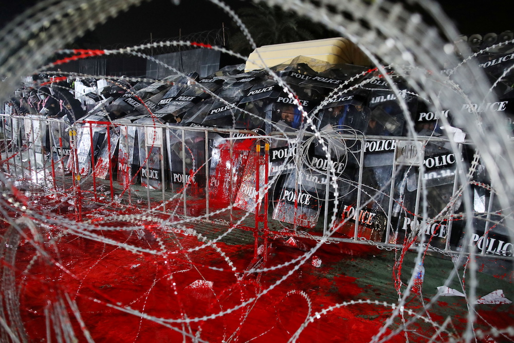Riot police cover themselves with shields during a pro-democracy rally at 11th Infantry Regiment, in Bangkok, Thailand, November 29, 2020. u00e2u20acu201d Reuters pic