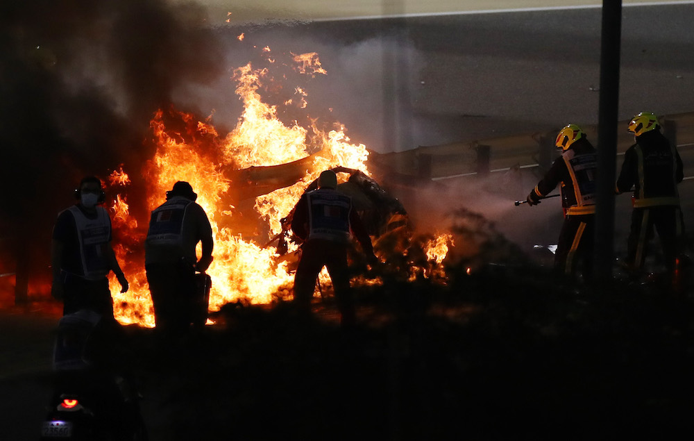 Stewards attempt to extinguish flames at the crash scene after Haas' Romain Grosjean crashed out at the start of the Bahrain Grand Prix in Sakhir, Bahrain November 29, 2020. u00e2u20acu201d Reuters pic