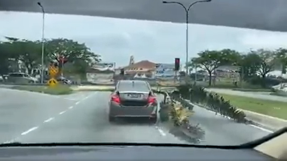 Police said the 30-year-old local man was issued a summons under LN 166/59 Rule 20 for carrying a load with an improper vehicle. u00e2u20acu201d Screen capture via Facebook