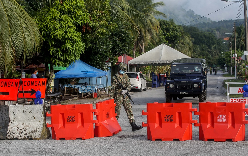 Armed Forces personnel man a road block at Zone B and Zone C of Taman Meru 2C in Ipoh November 20, 2020. u00e2u20acu201d Picture by Farhan Najib
