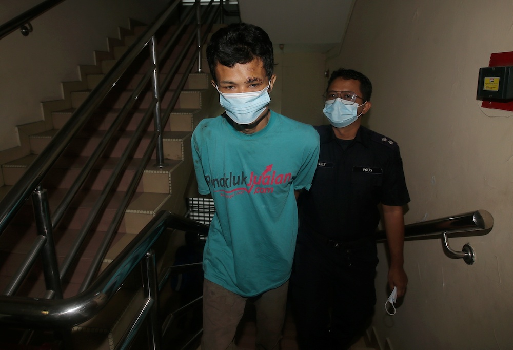 Nor Azman Mat Salleh, 35, claimed trial at the Magistrateu00e2u20acu2122s Court in Ipoh for ramming his motorcycle into a traffic police officer who was on duty at a roadblock. u00e2u20acu201d Picture by Farhan Najib