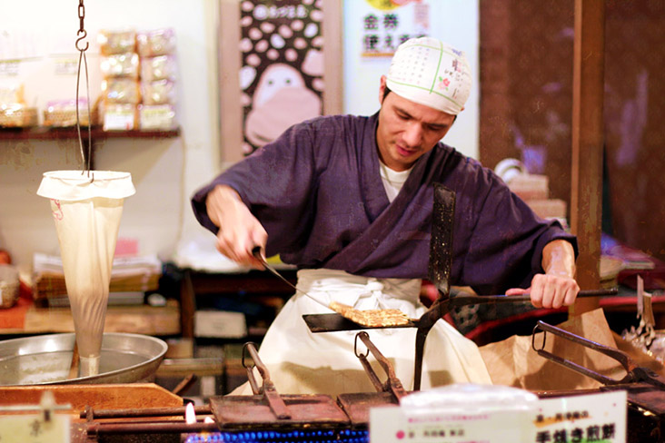 Japanese street vendors busy grilling, roasting and baking autumnal treats