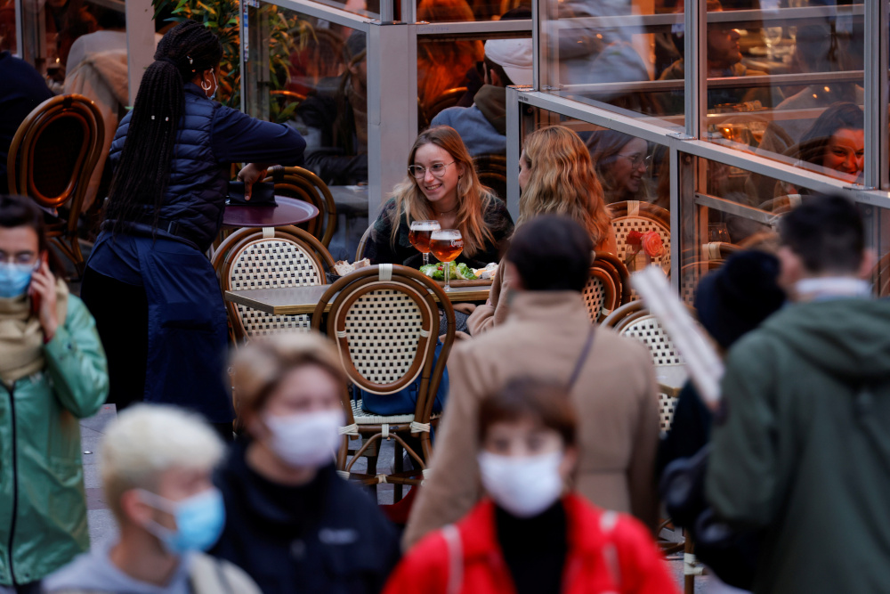 People sit at bar terraces and enjoy their beers before the late-night curfew due to restrictions against the spread of the coronavirus disease in Lille, France, October 16, 2020. u00e2u20acu201d Reuters picnn