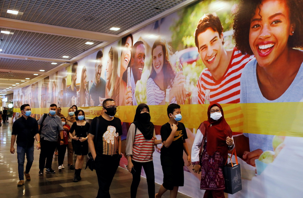 People wearing protective masks walk at a shopping mall as the coronavirus disease outbreak continues in Jakarta, Indonesia, November 8, 2020. u00e2u20acu2022 Reuters picnn