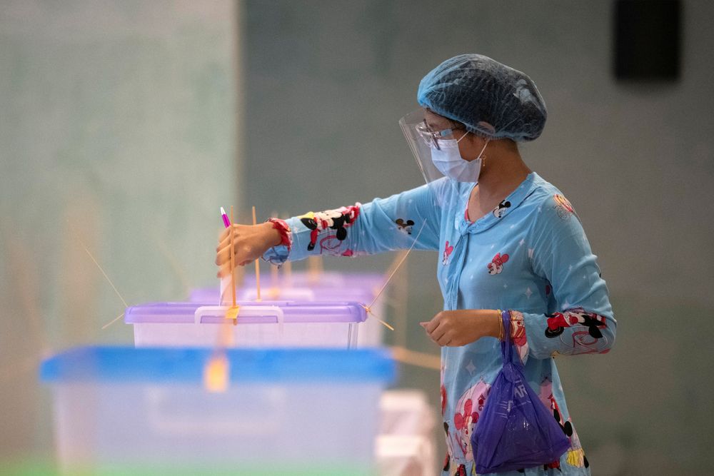 A woman wearing a protective face masks casts her ballot for the general election at a polling station in Yangon, Myanmar, November 8, 2020. u00e2u20acu201d Reuters pic