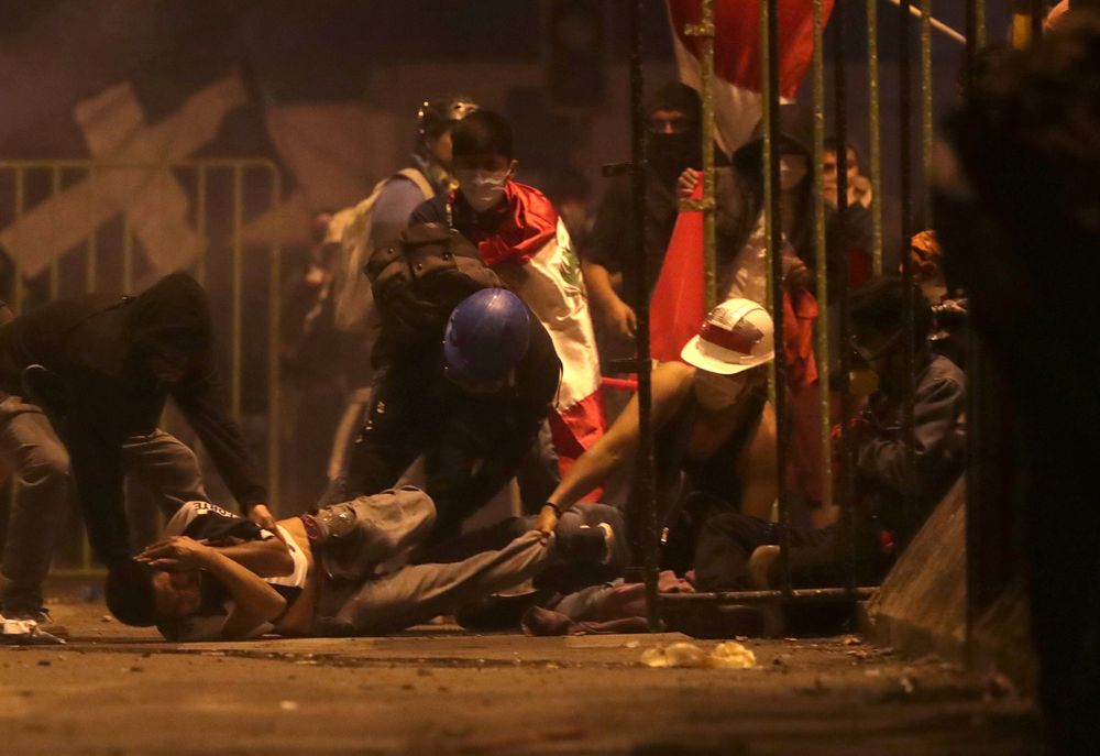 A demonstrator is injured on the ground as he is help by others during a clash with police during a protest against the decision of Congress to remove former President Martin Vizcarra, in Lima, Peru, November 14, 2020. u00e2u20acu201d Reuters pic
