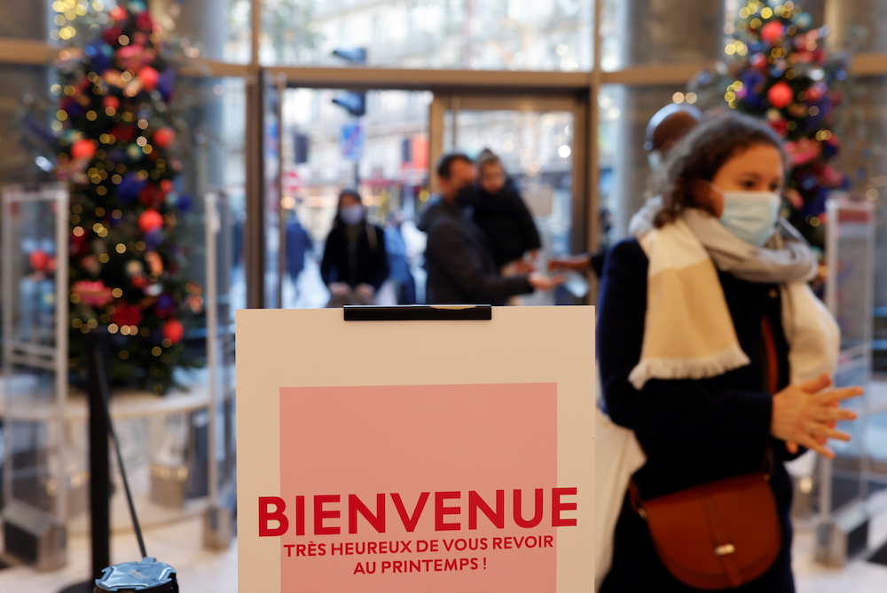 People wearing protective face masks visit the department store Le Printemps Haussmann as shops reopen doors after weeks of lockdown to combat a resurgence of the coronavirus disease outbreak, in Paris, France, November 28, 2020. u00e2u20acu201d Reuters picnn