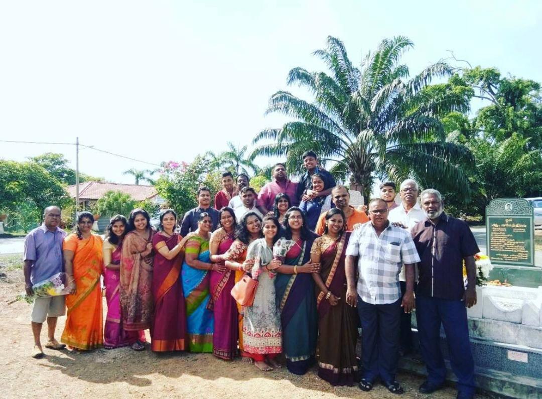 Taarani and her family in traditional attire after visiting her paternal grandparents' grave in Alor Gajah, Melaka last year. u00e2u20acu201d Picture by Taarani Rajendran.