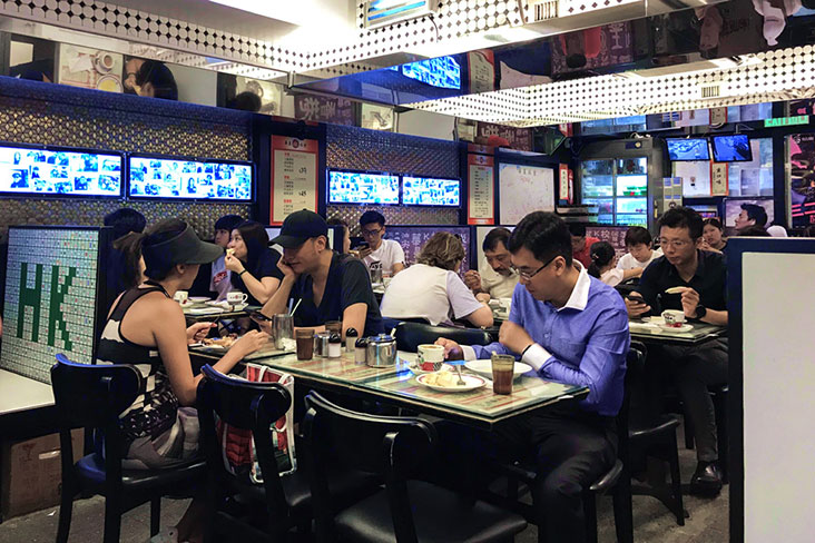 Lunchtime at an old-school 'char chan teng' in Mongkok, Hong Kong.