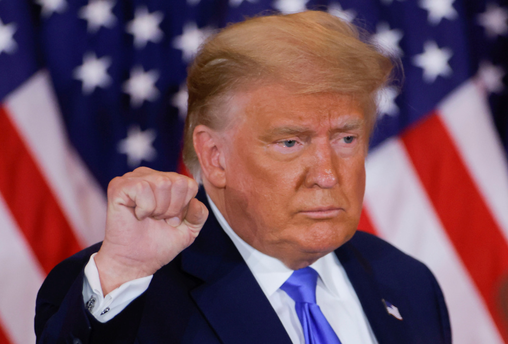 US President Donald Trump raises his fist as he reacts to early results from the 2020 US presidential election in the East Room of the White House in Washington, US, November 4, 2020. u00e2u20acu201d Reuters pic 