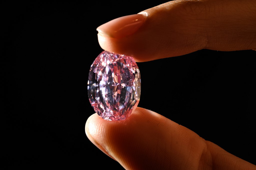 A picture taken on November 6, 2020 in Geneva shows the u00e2u20acu02dcThe Spirit of the Roseu00e2u20acu2122, a rare 14.83 carats vivid purple pink diamond during a press preview ahead of sales by Sothebyu00e2u20acu2122s auction house. u00e2u20acu201d AFP pic