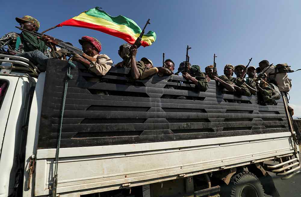 Members of Amhara region militias ride on their truck as they head to face the Tigray People's Liberation Front (TPLF), in Sanja, Amhara region, Ethiopia November 9, 2020. u00e2u20acu201d Reuters pic