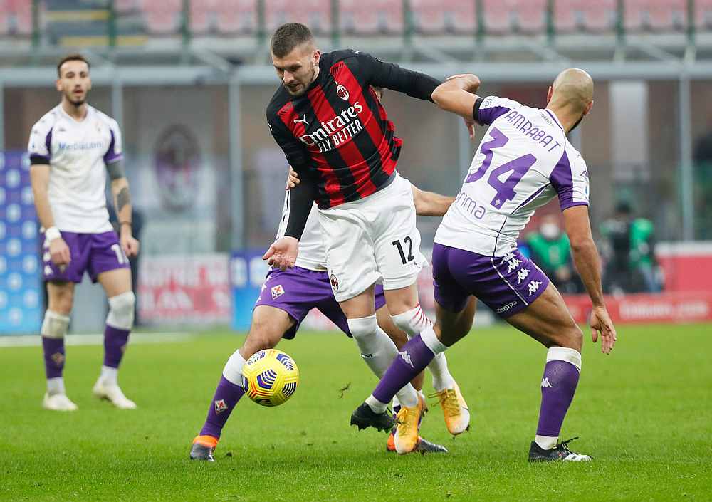 AC Milan's Ante Rebic (centre) in action with Fiorentina's Sofyan Amrabat in the Serie A match at San Siro, Milan, Italy November 29, 2020. u00e2u20acu201d Reuters pic