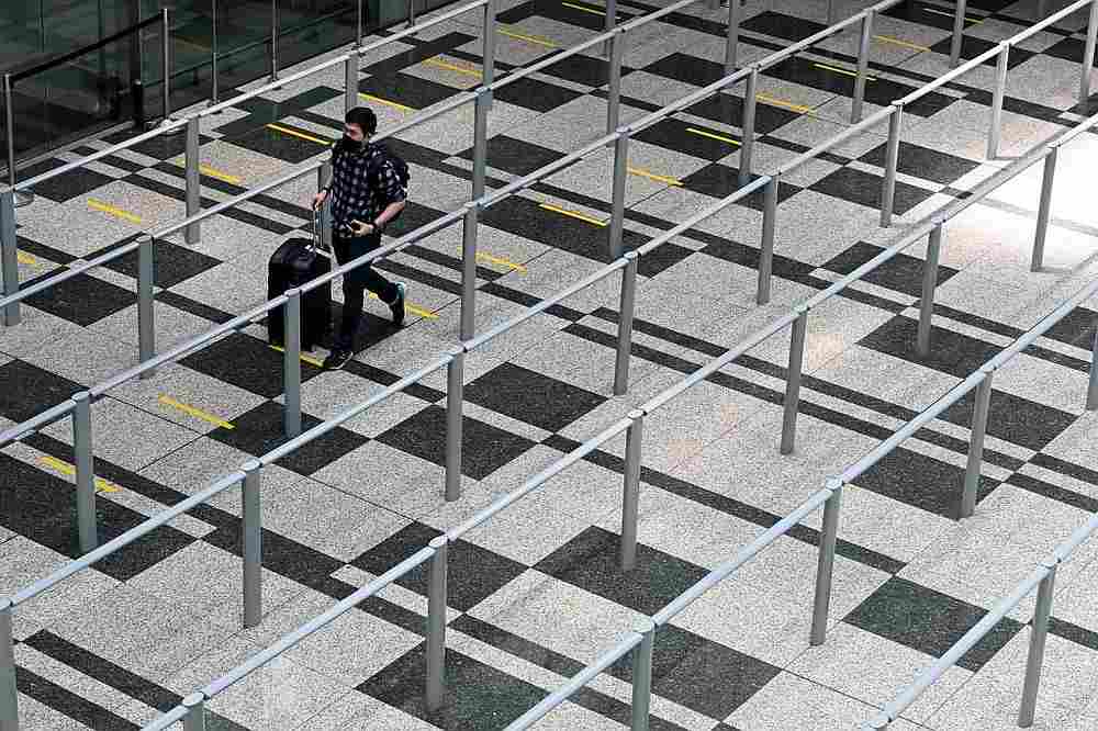 An arriving passenger walking to the taxi queue area in a terminal of Changi International Airport, Singapore September 11, 2020. u00e2u20acu201d AFP pic