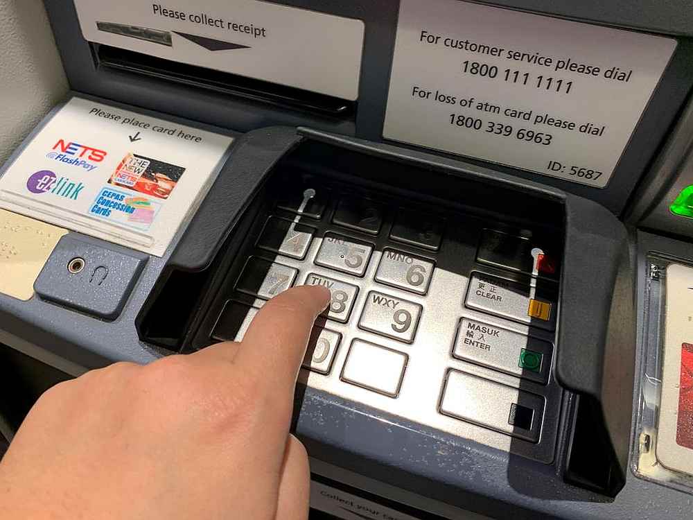 Yap Yi San withdrew cash four times using an ATM card he had found in Singapore, amassing S$8,000 altogether. u00e2u20acu201d TODAY pic