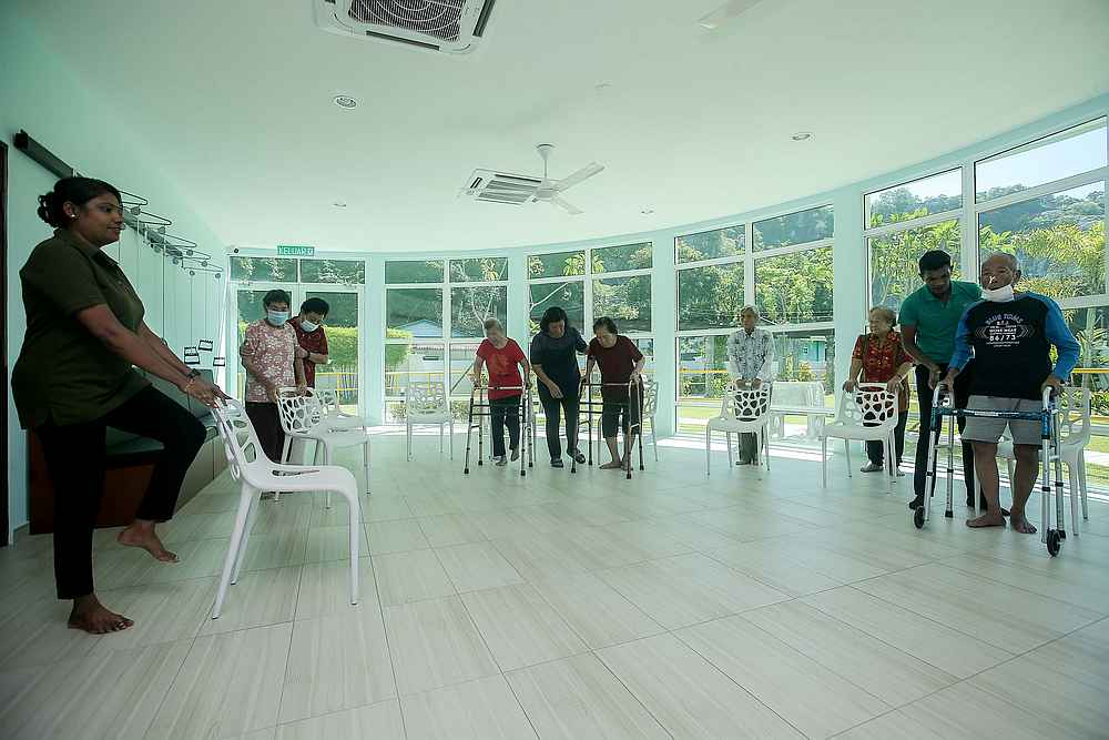 An exercise in session at the BebeLEC Day Care Centre for dementia patients in Ipoh. u00e2u20acu201d Picture by Farhan Najib